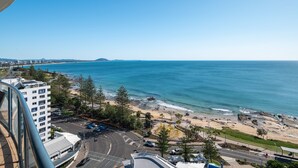 A coastal cityscape with a beach, buildings, and a road. - Mantra Mooloolaba Beach (Mooloolaba)