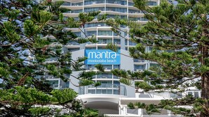 A modern multi-story building with a prominent sign reading "mantra moooloolaba beach". - Mantra Mooloolaba Beach (Mooloolaba)