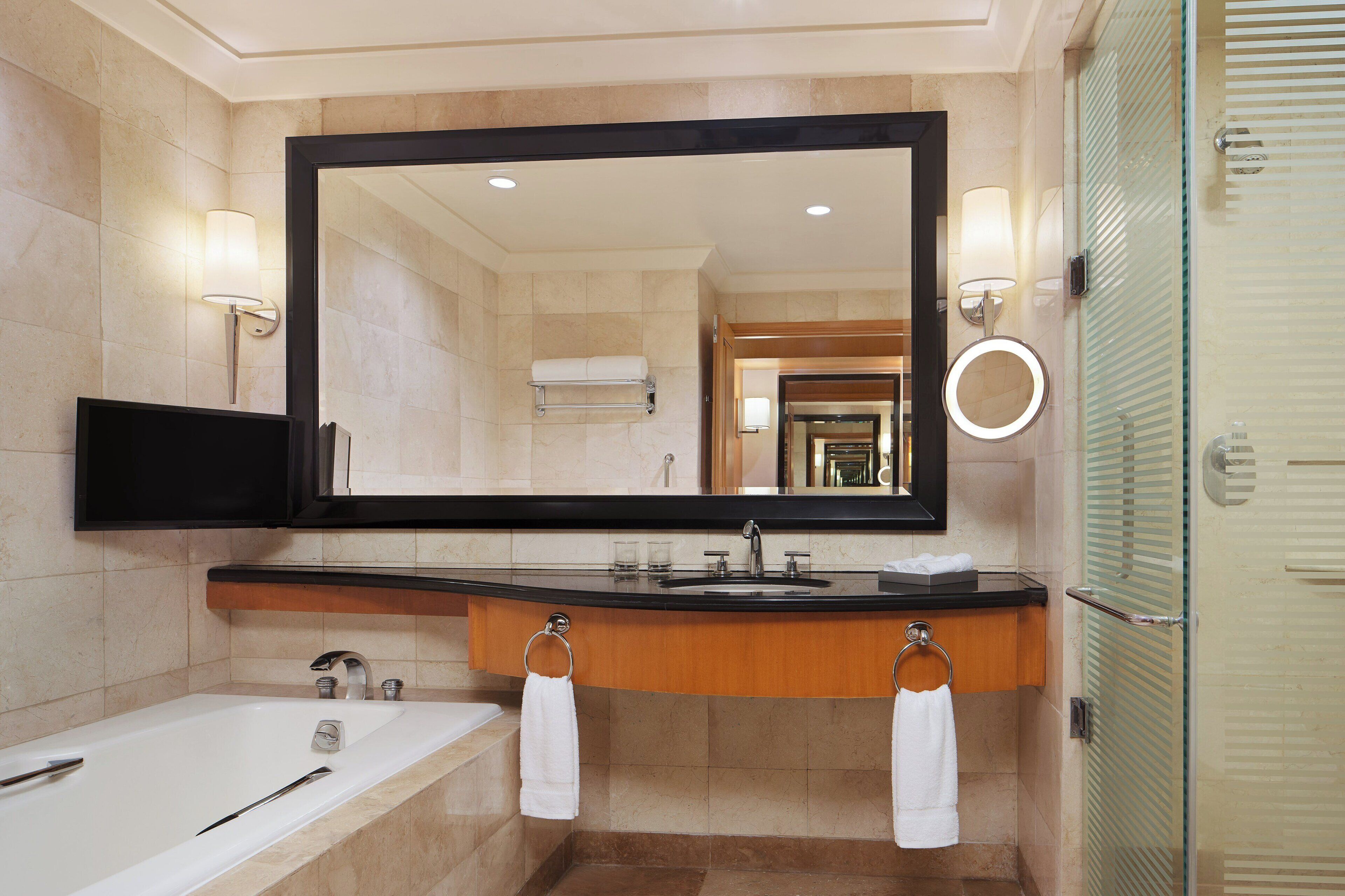 executive suite, 1 bedroom, city view | bathroom | deep-soaking bathtub, free toiletries, hair dryer, bathrobes