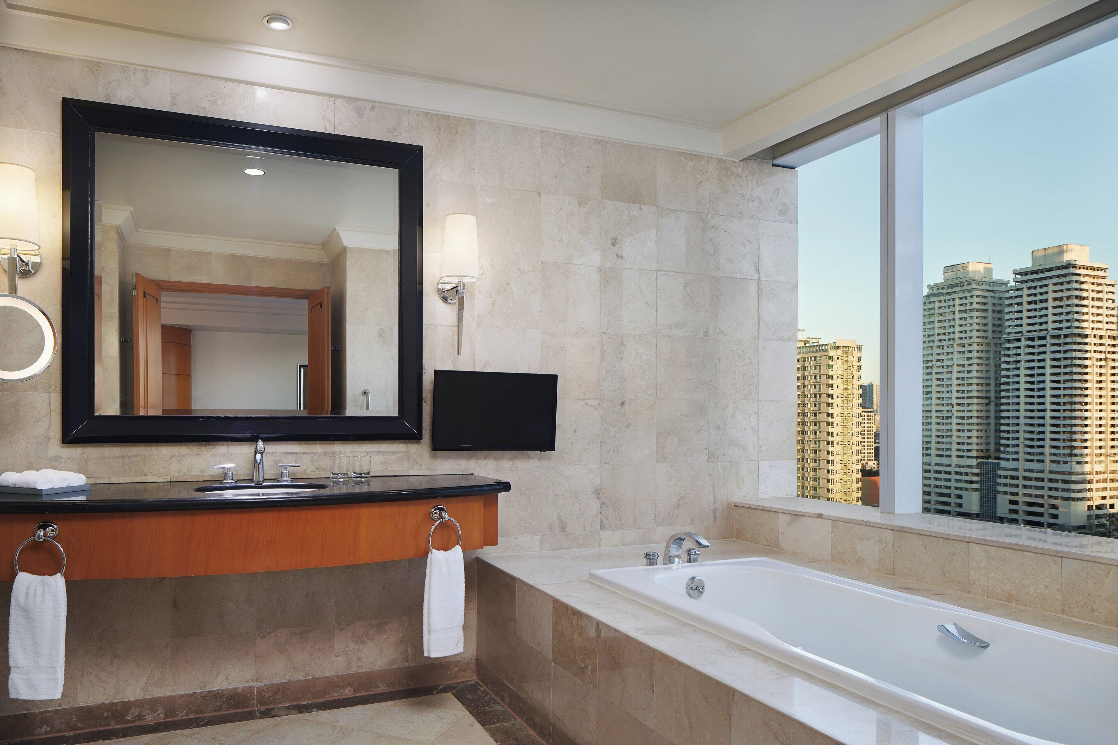junior suite, 1 bedroom, city view | bathroom | deep-soaking bathtub, free toiletries, hair dryer, bathrobes