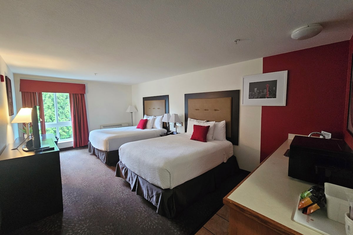 deluxe room, 2 queen beds, non smoking | hypo-allergenic bedding, desk, blackout curtains, iron/ironing board