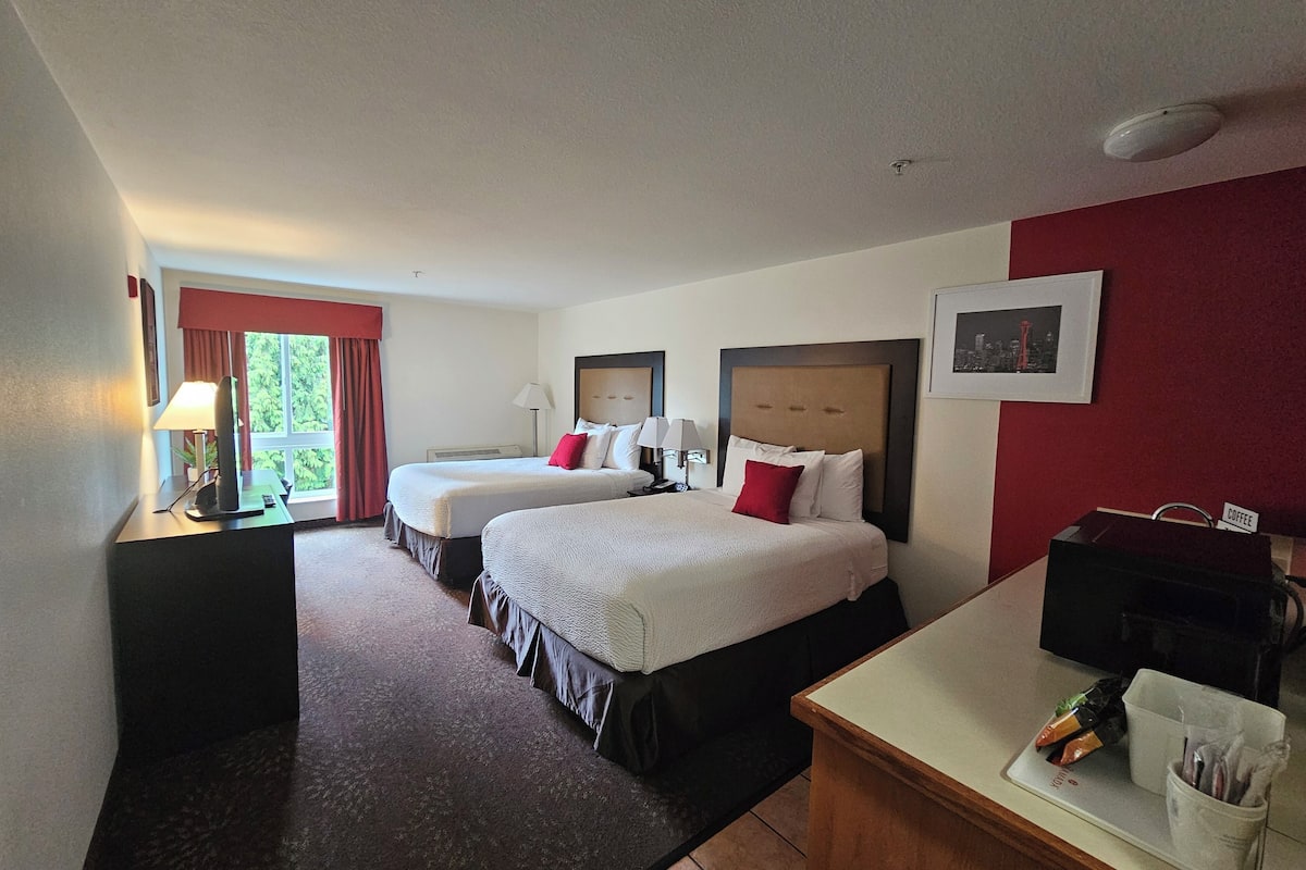 deluxe room, 2 queen beds, non smoking | hypo-allergenic bedding, desk, blackout curtains, iron/ironing board