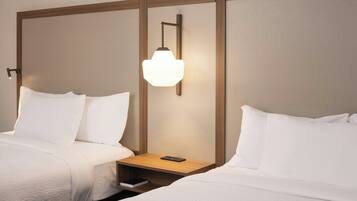 Premium bedding, desk, laptop workspace, blackout curtains