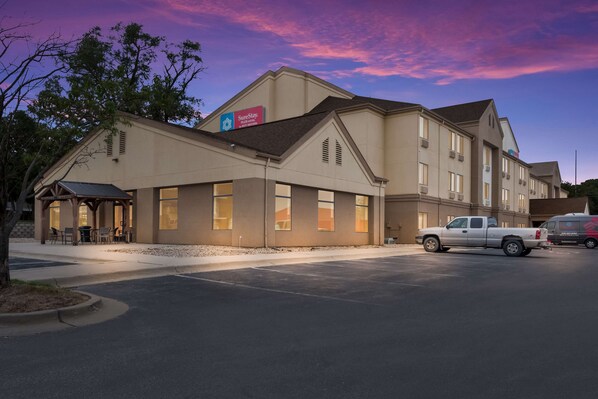 Guests can enjoy outdoor seating at the hotel's covered patio area.
