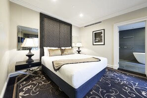 Premium King Suite | In-room safe, desk, blackout curtains, iron/ironing board