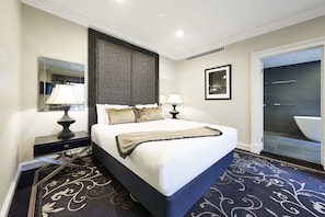Premium King Suite | In-room safe, desk, blackout curtains, iron/ironing board