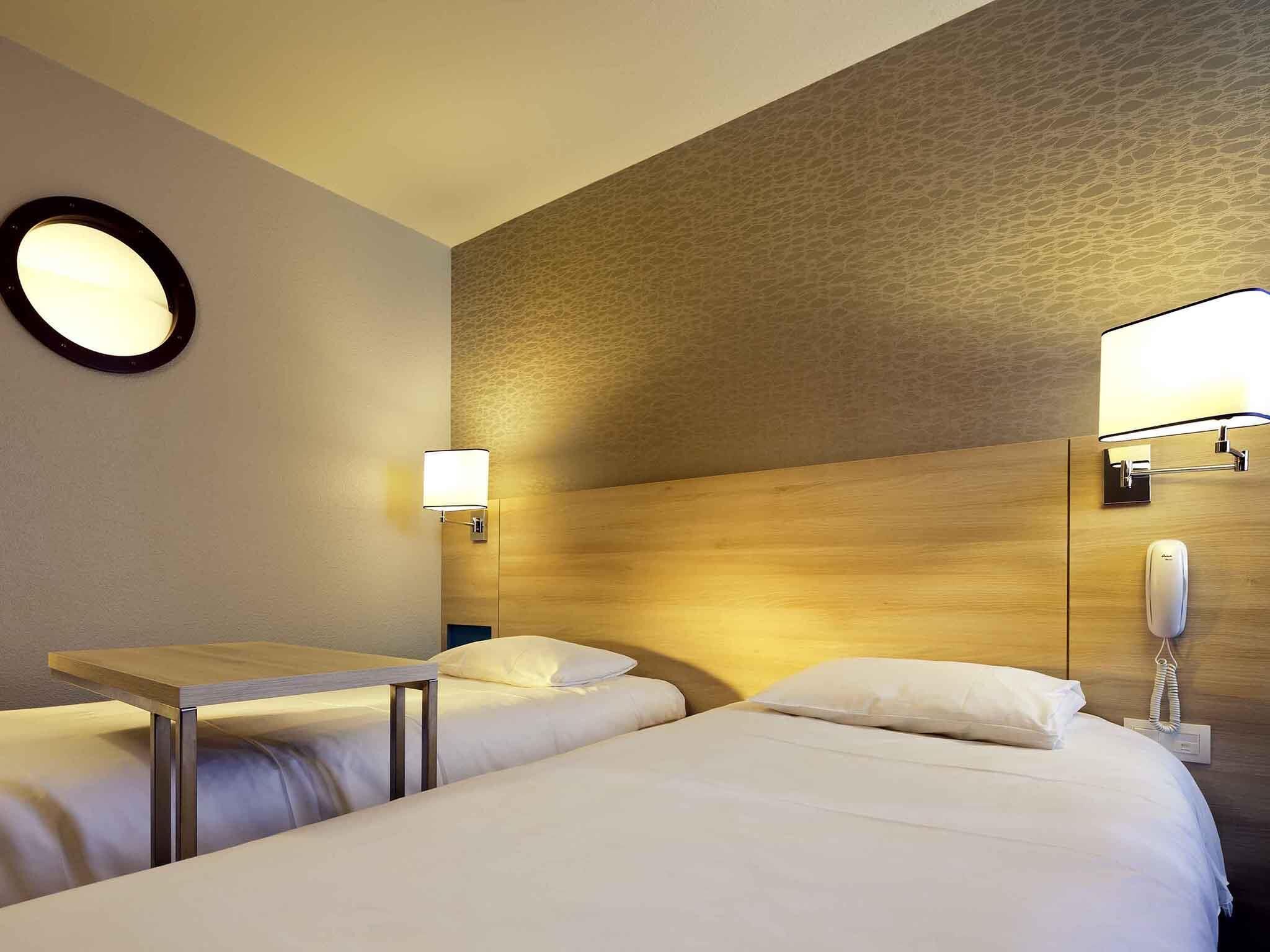 Premium bedding, blackout curtains, iron/ironing board