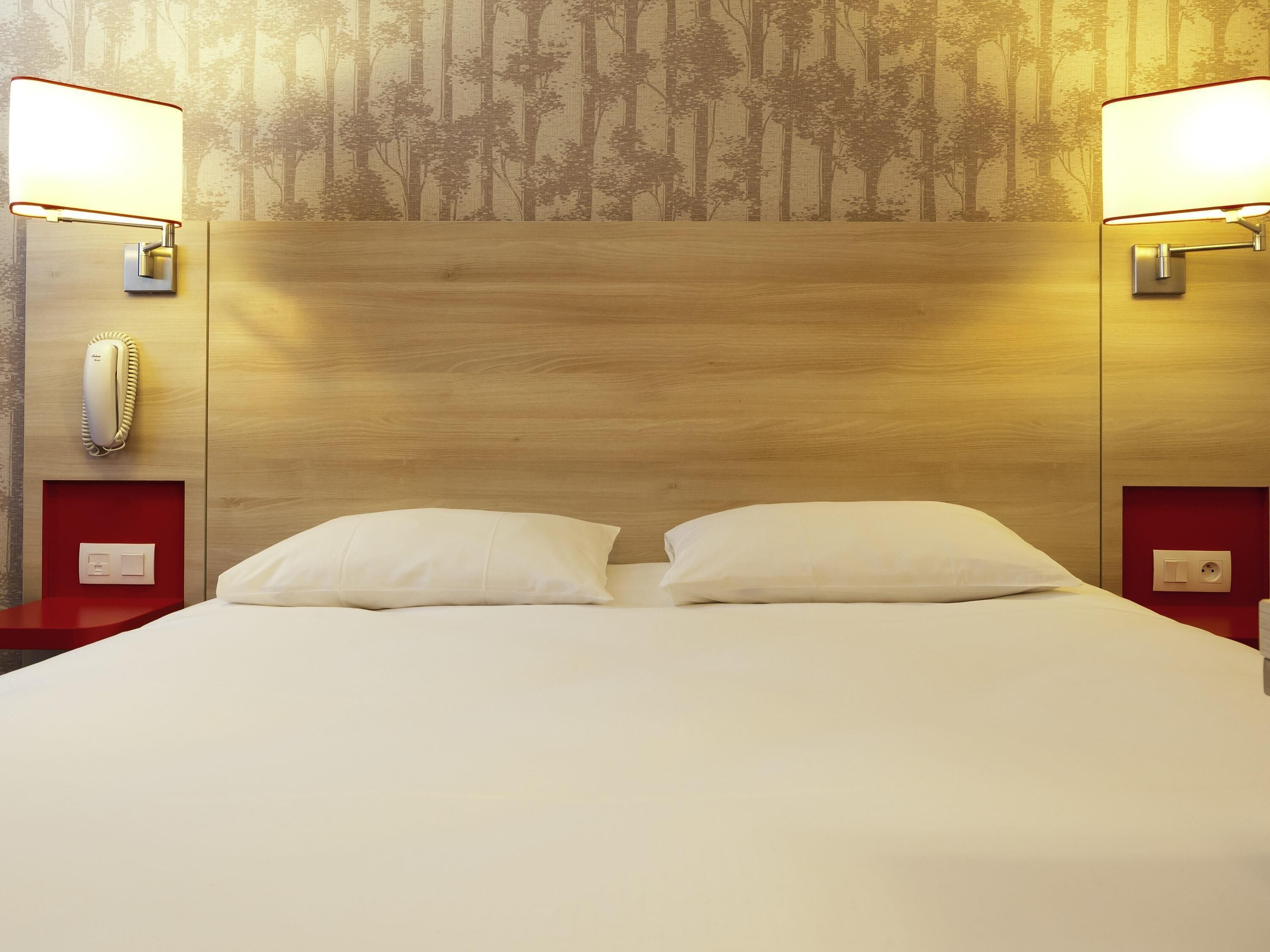 Premium bedding, blackout drapes, iron/ironing board