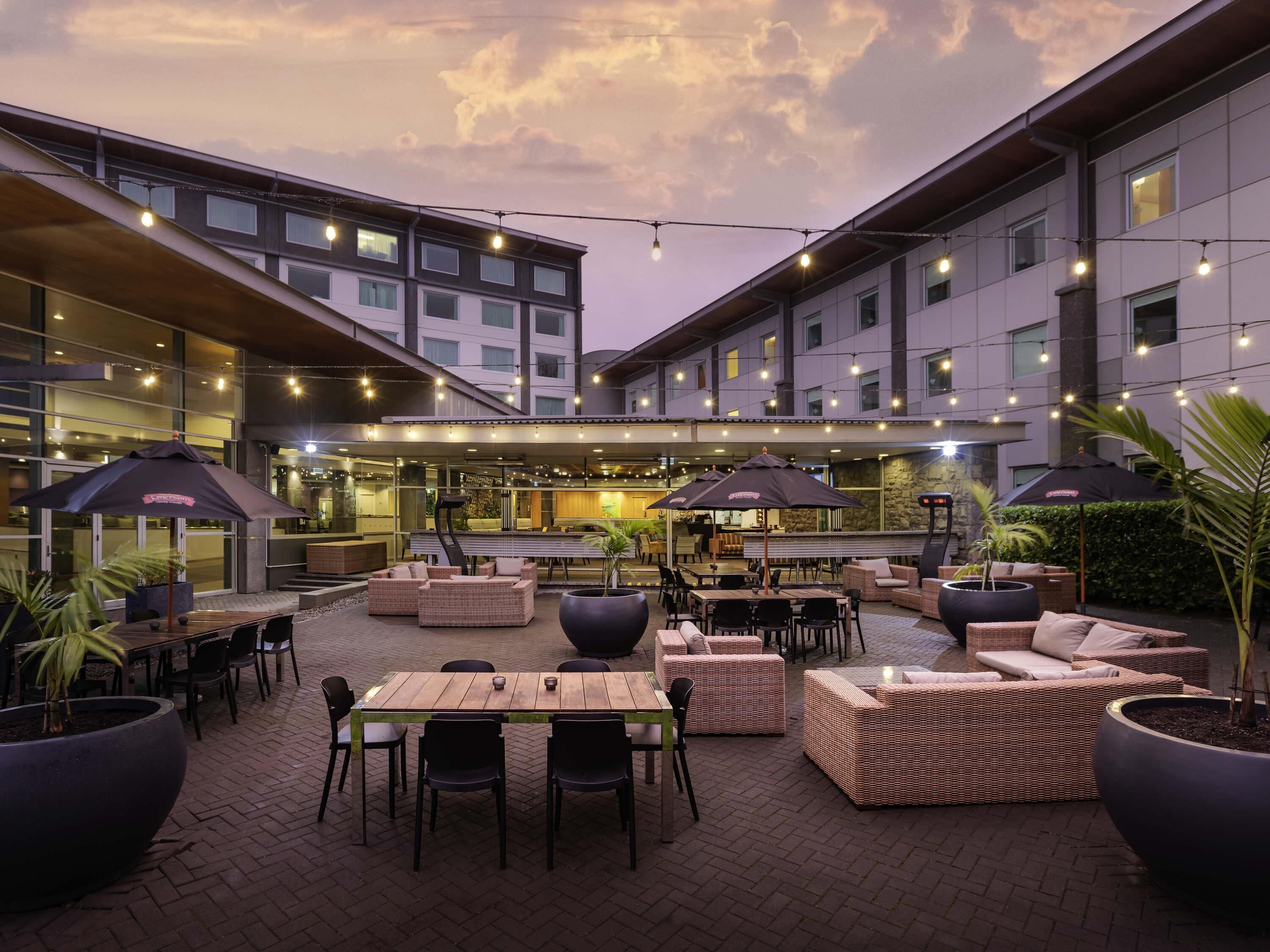 Breakfast, dinner served; international cuisine, al fresco dining 