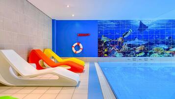 Indoor pool, open 8:00 AM to 11:00 PM, pool loungers