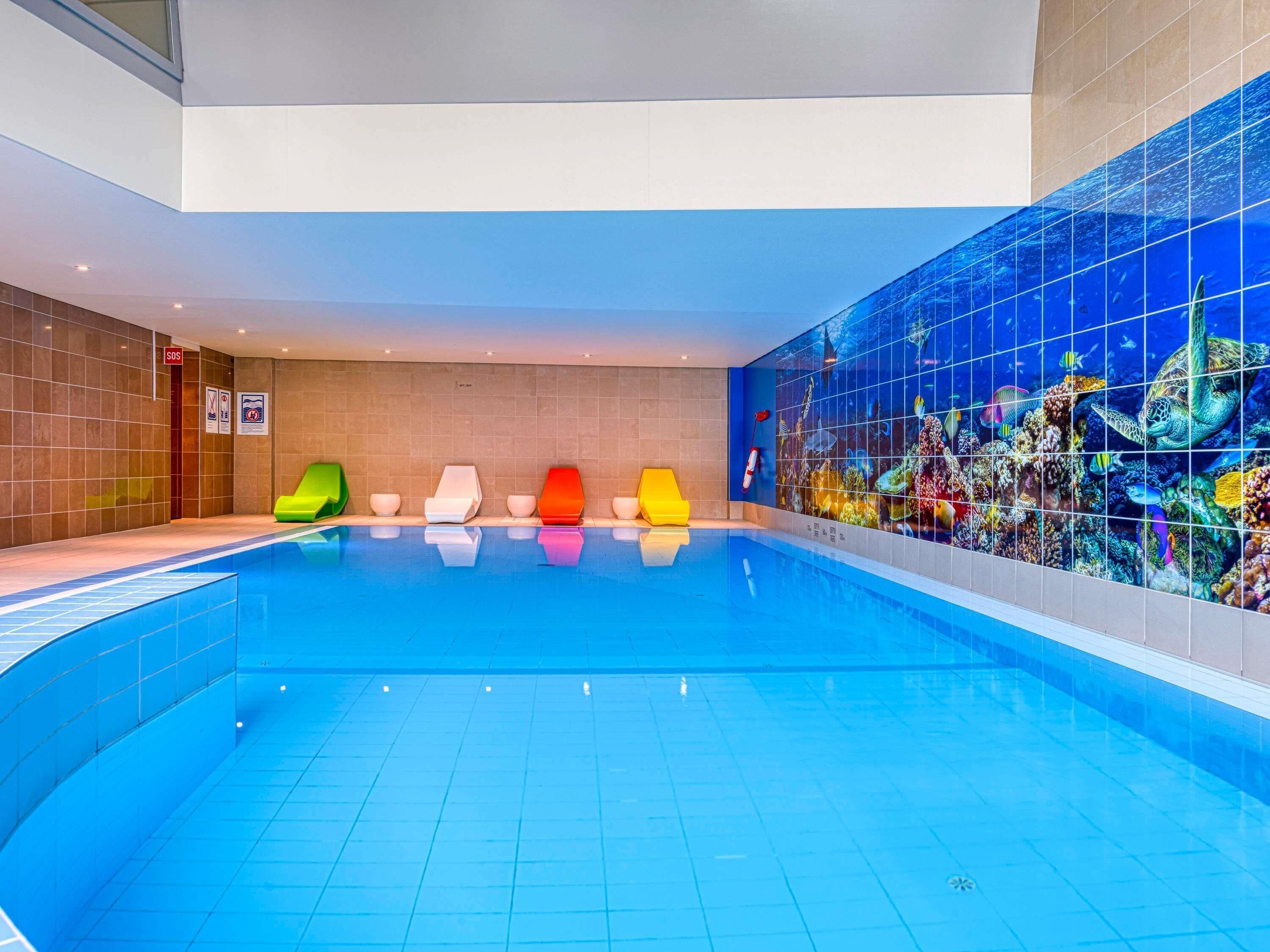 Indoor pool, open 8:00 AM to 11:00 PM, pool loungers