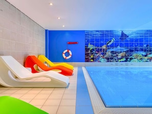 Indoor pool, open 8:00 AM to 11:00 PM, pool loungers