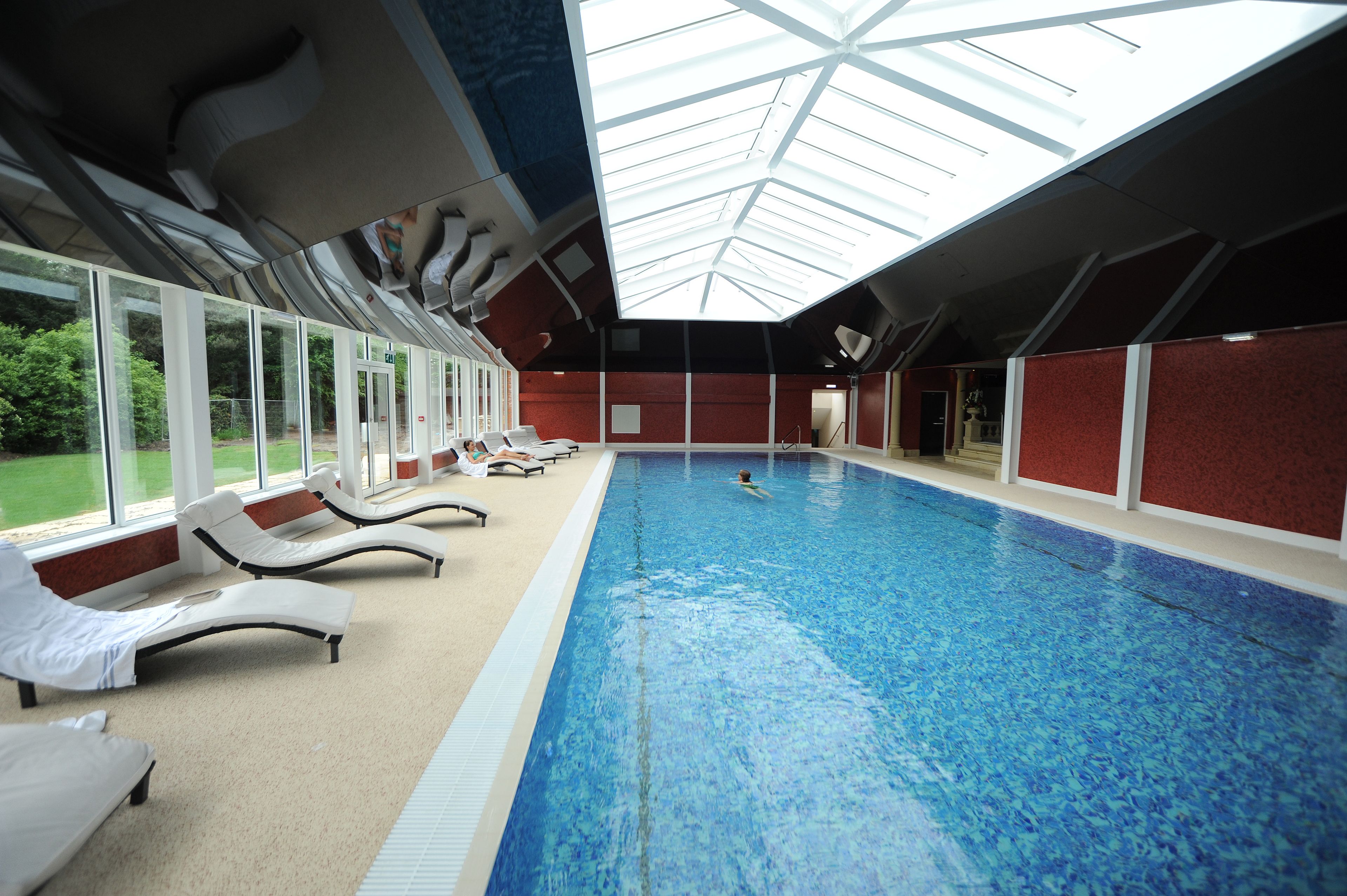 indoor pool, open 8:00 am to 7:00 pm, pool loungers