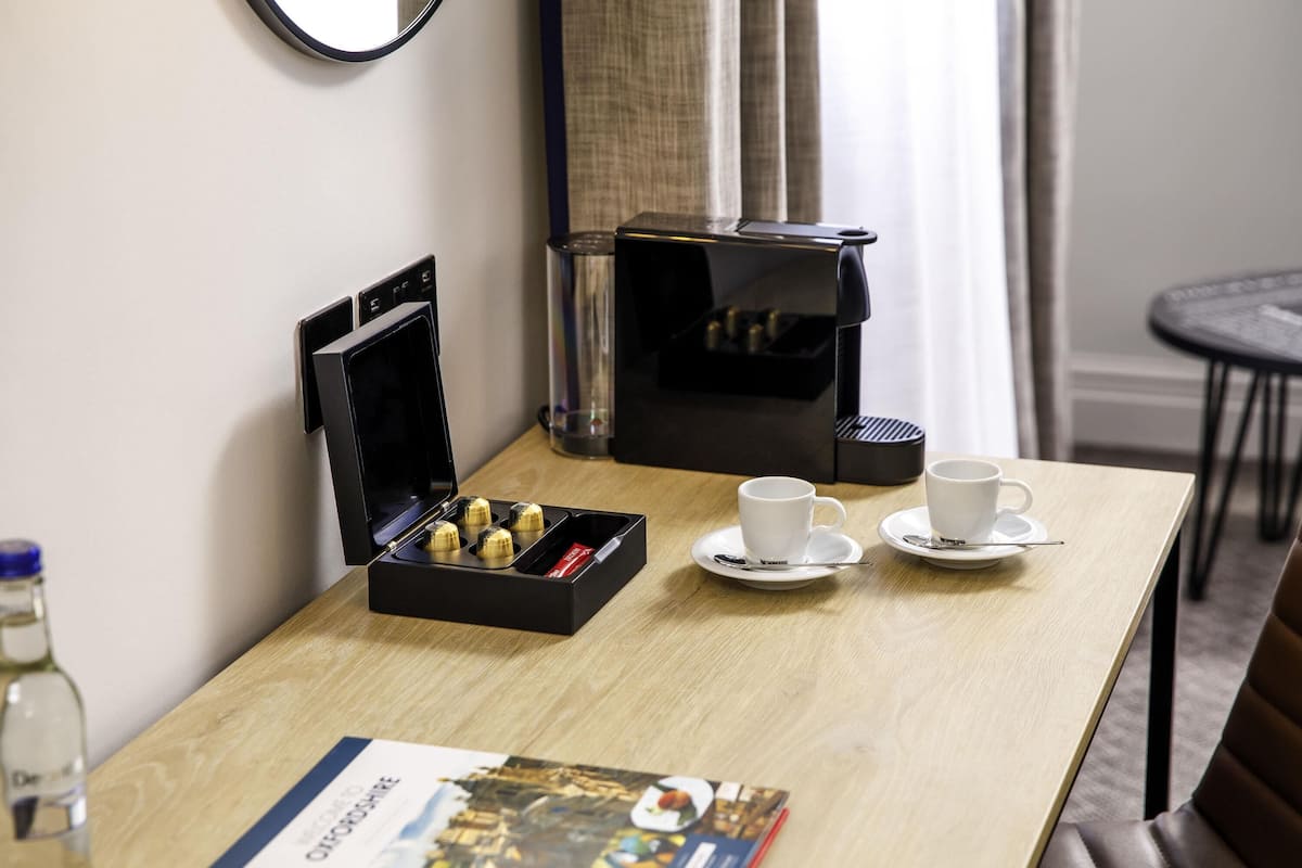 Desk, laptop workspace, blackout drapes, iron/ironing board