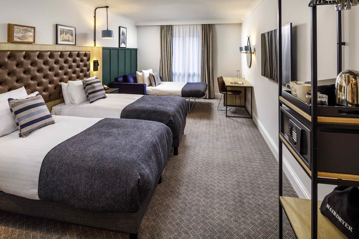 Privilege, Family Room, Multiple Beds | Desk, laptop workspace, blackout drapes, iron/ironing board