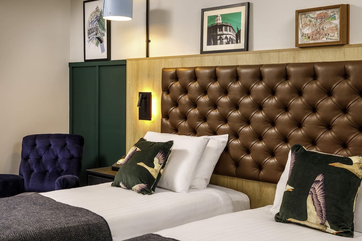 Desk, laptop workspace, blackout drapes, iron/ironing board