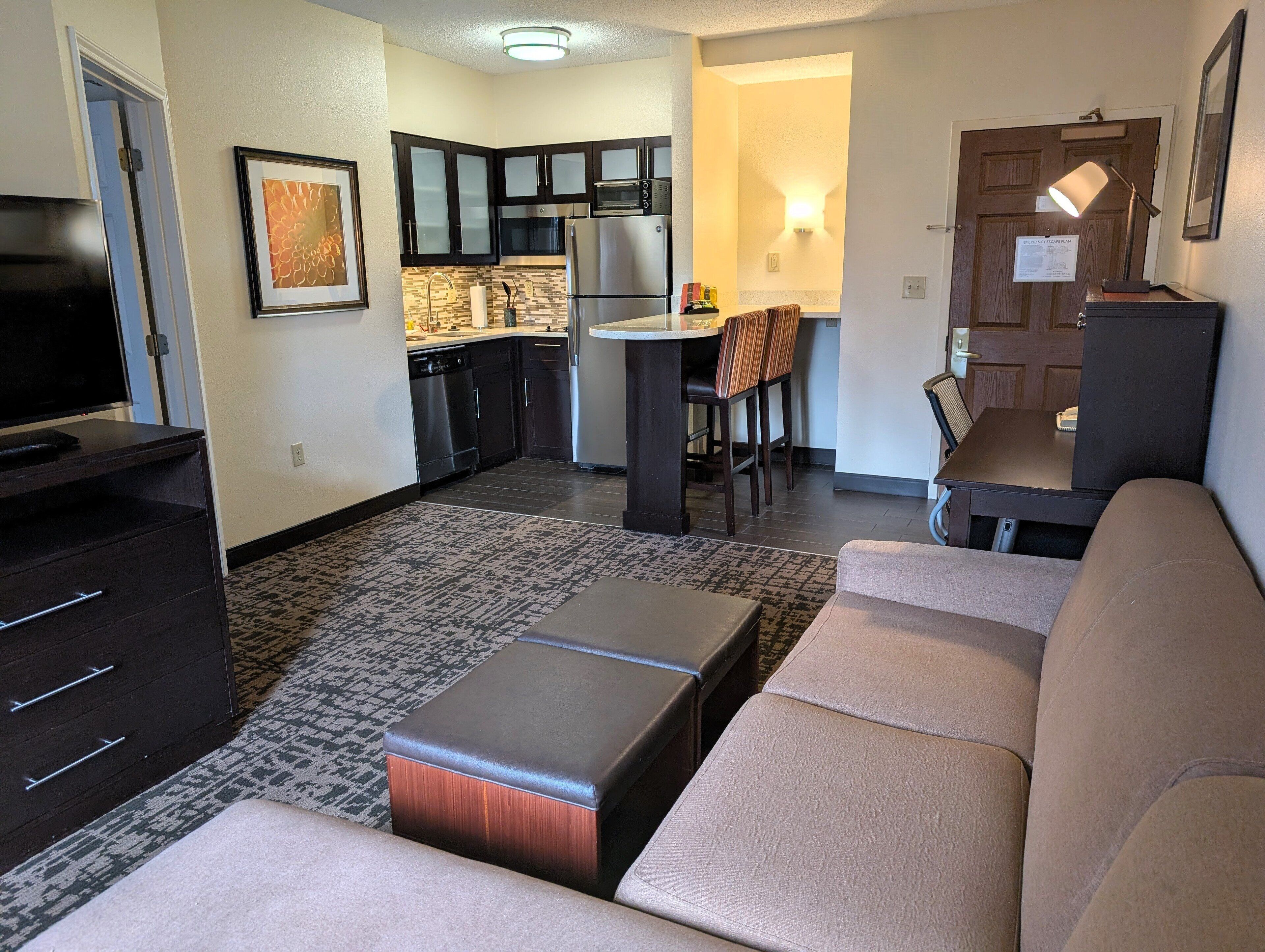 Premium bedding, desk, laptop workspace, blackout curtains