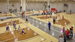 A multi-basketball court with multiple games in progress. - Staybridge Suites Indianapolis-Fishers by IHG (Indianapolis)
