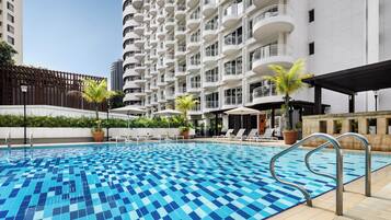 Outdoor pool, open 7:00 AM to 10:00 PM, pool umbrellas, pool loungers