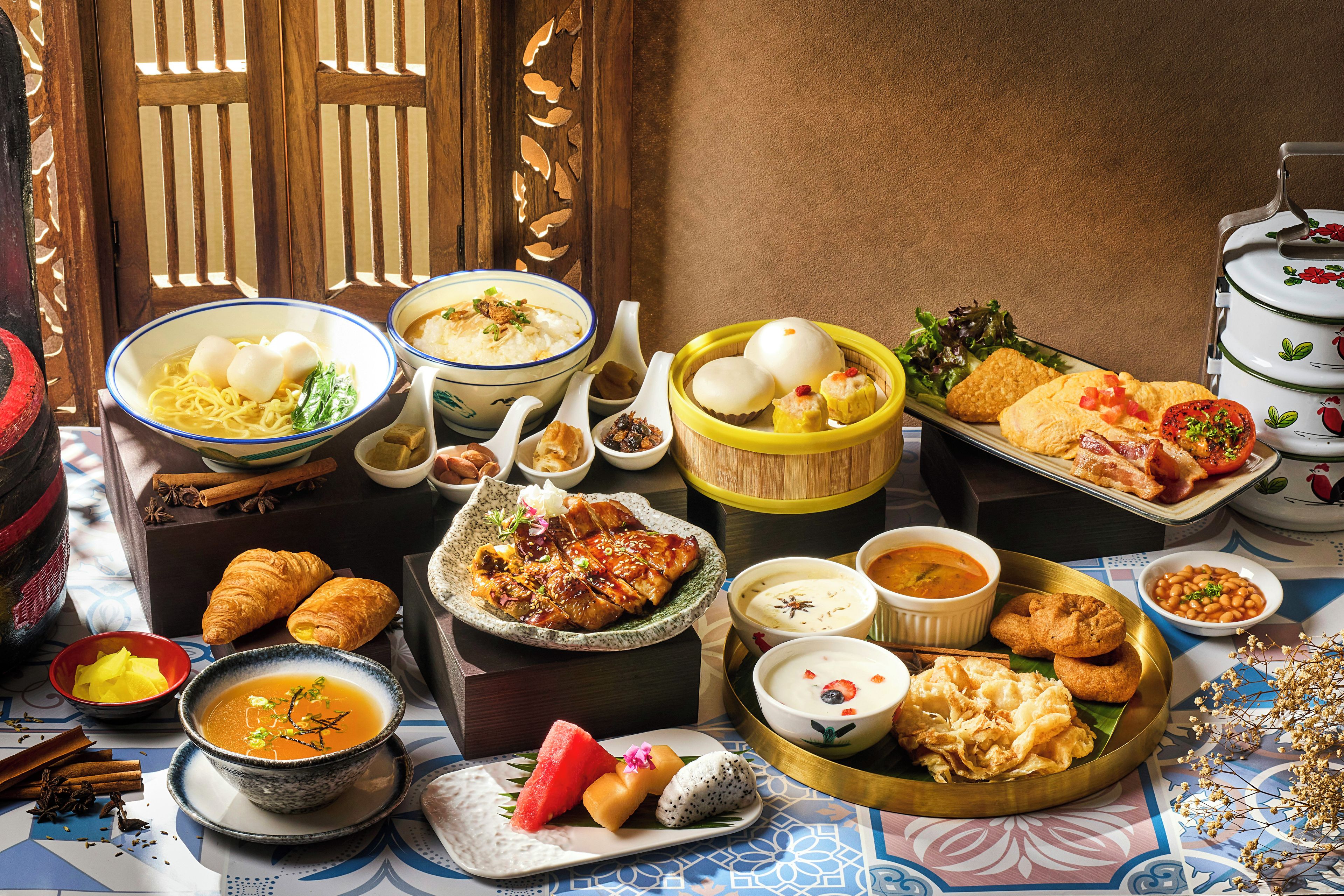 A variety of dishes and food items arranged on a table, suggesting a meal setting.