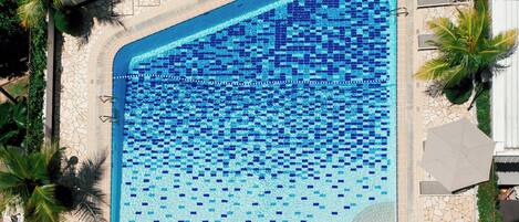 Outdoor pool, open 7:00 AM to 10:00 PM, pool umbrellas, sun loungers