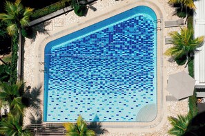 Outdoor pool, open 7:00 AM to 10:00 PM, pool umbrellas, pool loungers