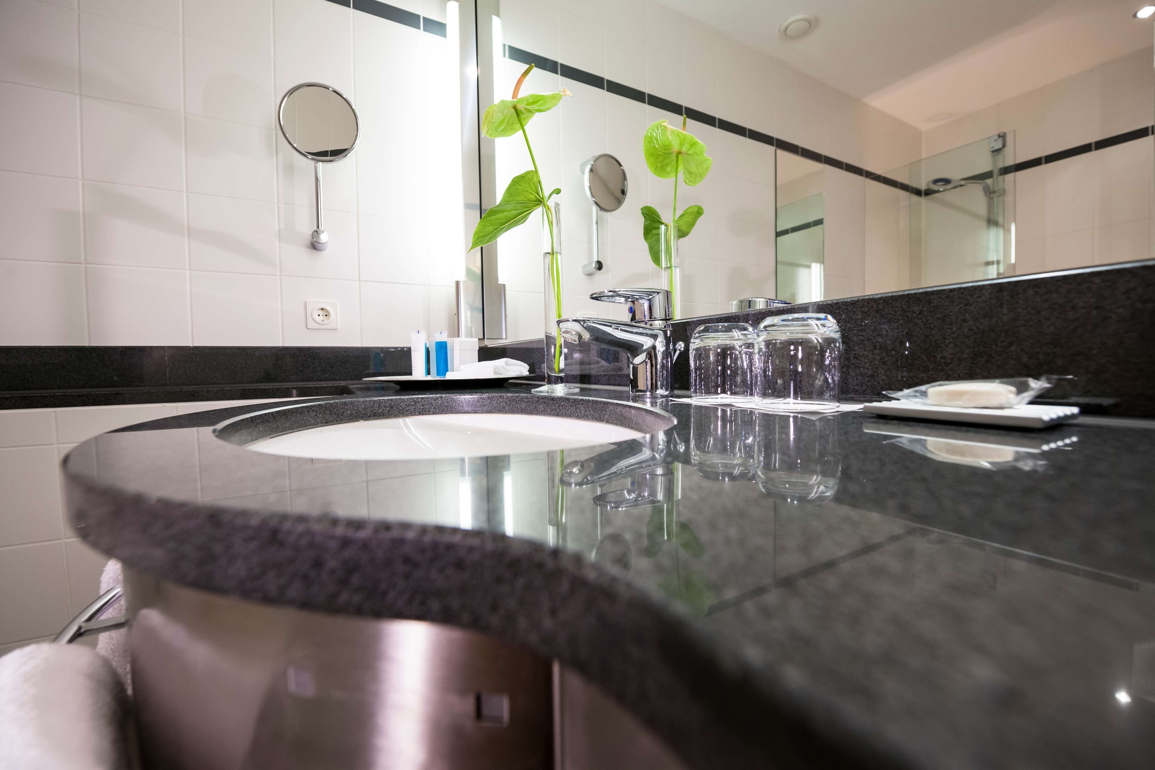 bathtub, designer toiletries, hair dryer, bathrobes