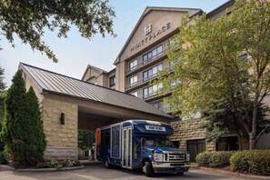 Experience the convenience of our hotel's shuttle service and modern architecture.