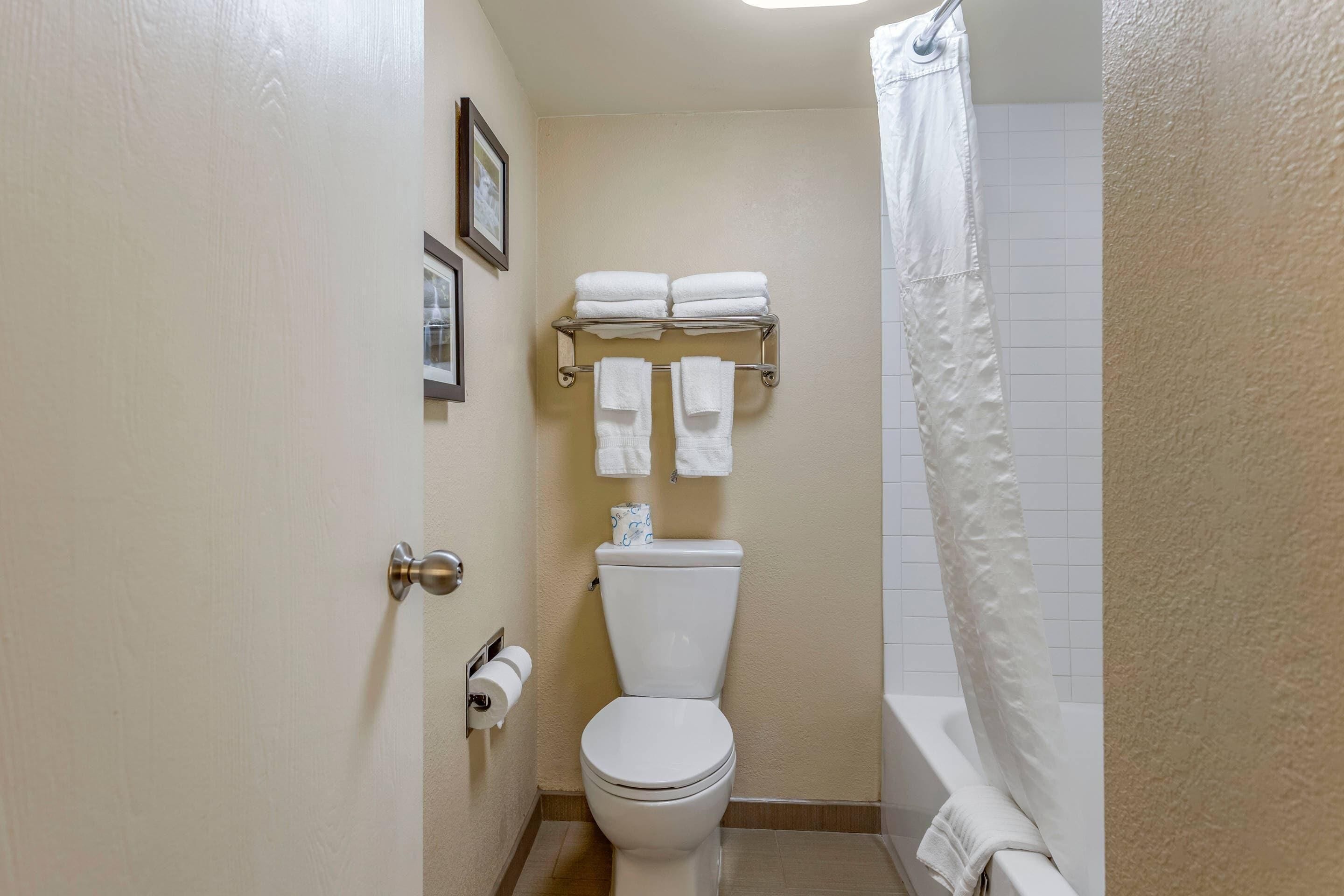 Premium bedding, desk, laptop workspace, blackout curtains