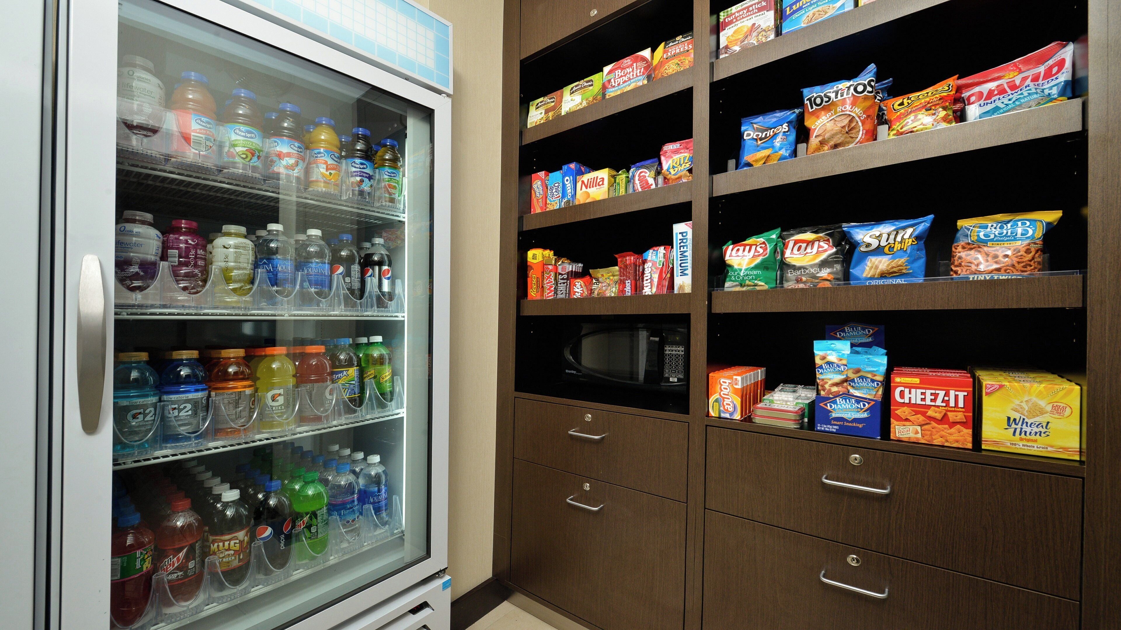 A vending machine stocked with various beverages and snacks.