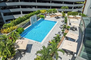 Outdoor pool, open 7:00 AM to 9:00 PM, pool umbrellas, sun loungers