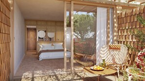 A bedroom with a bed, a small table with fruits, and a chair. - Le Mirage (Bormes-Les-Mimosas)