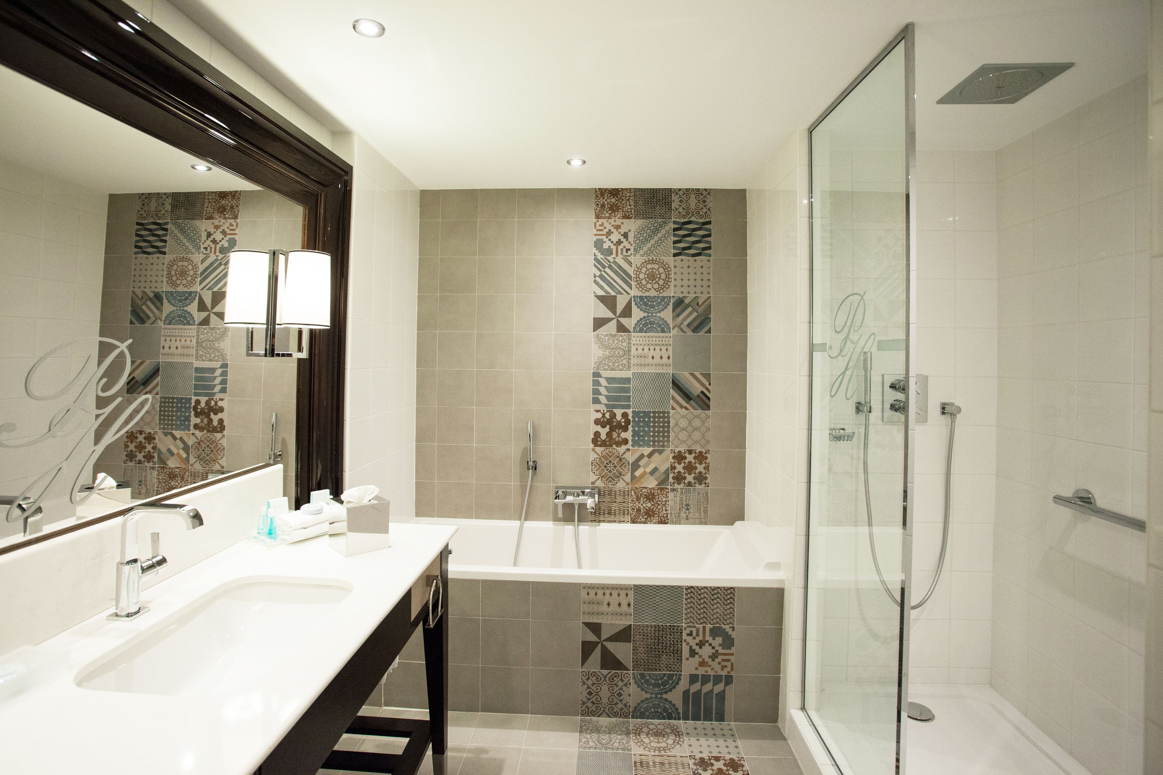 combined shower/bathtub, designer toiletries, hair dryer, bathrobes