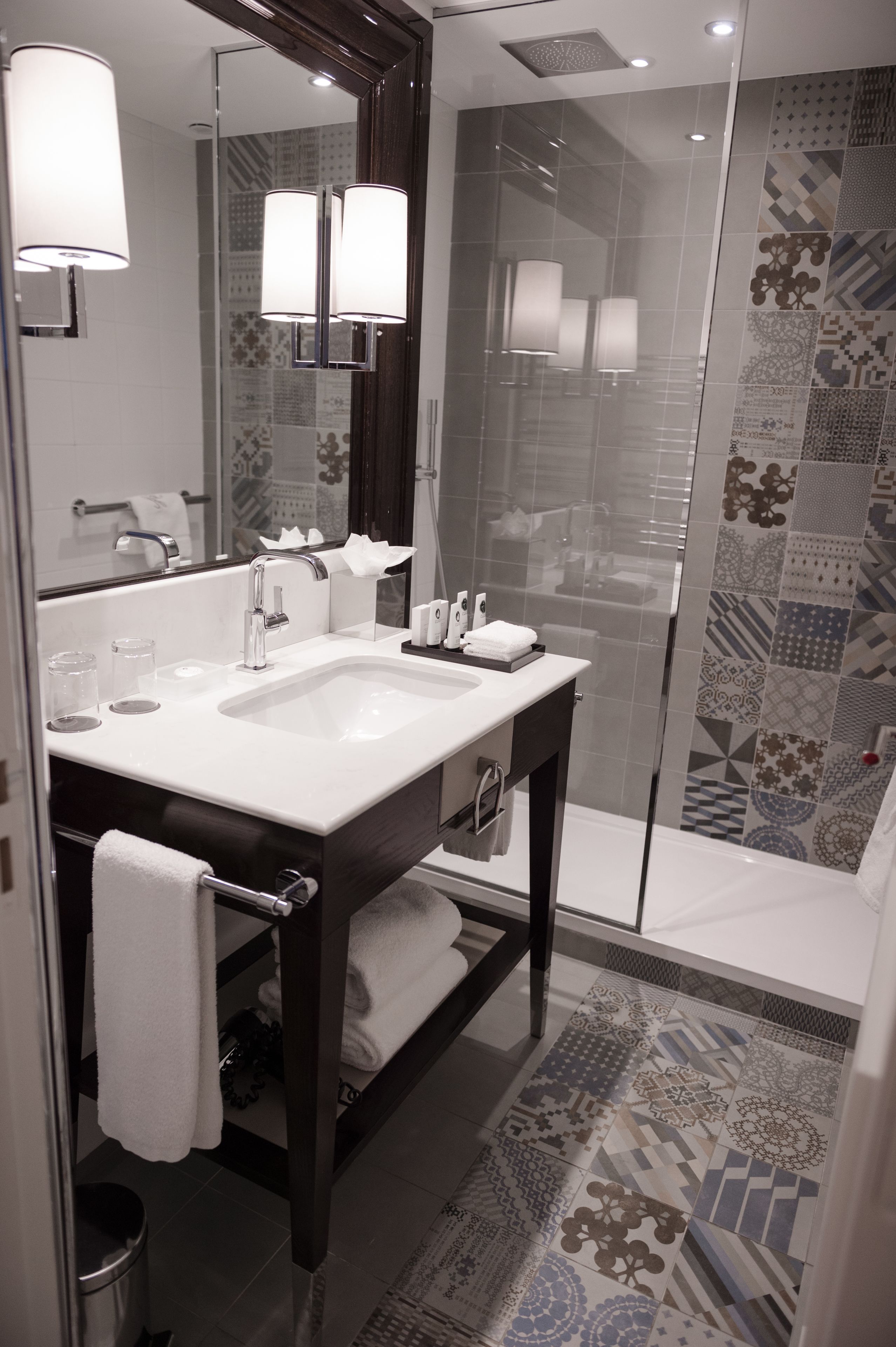 combined shower/bathtub, designer toiletries, hair dryer, bathrobes