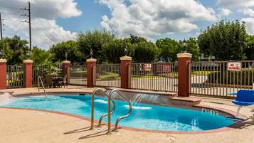 Seasonal outdoor pool, open 10:00 AM to 8:00 PM, pool umbrellas