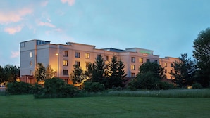 A multi-story hotel with a flat roof and a sign indicating it is a Courtyard Inn. - Courtyard by Marriott Ithaca Airport/University (Ithaca)