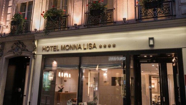 A hotel facade with ornate balconies, a clear entrance, and a sign reading "HOTEL MONNA LISA." - Hôtel Le Monna Lisa by Inwood Hotels (Paris)
