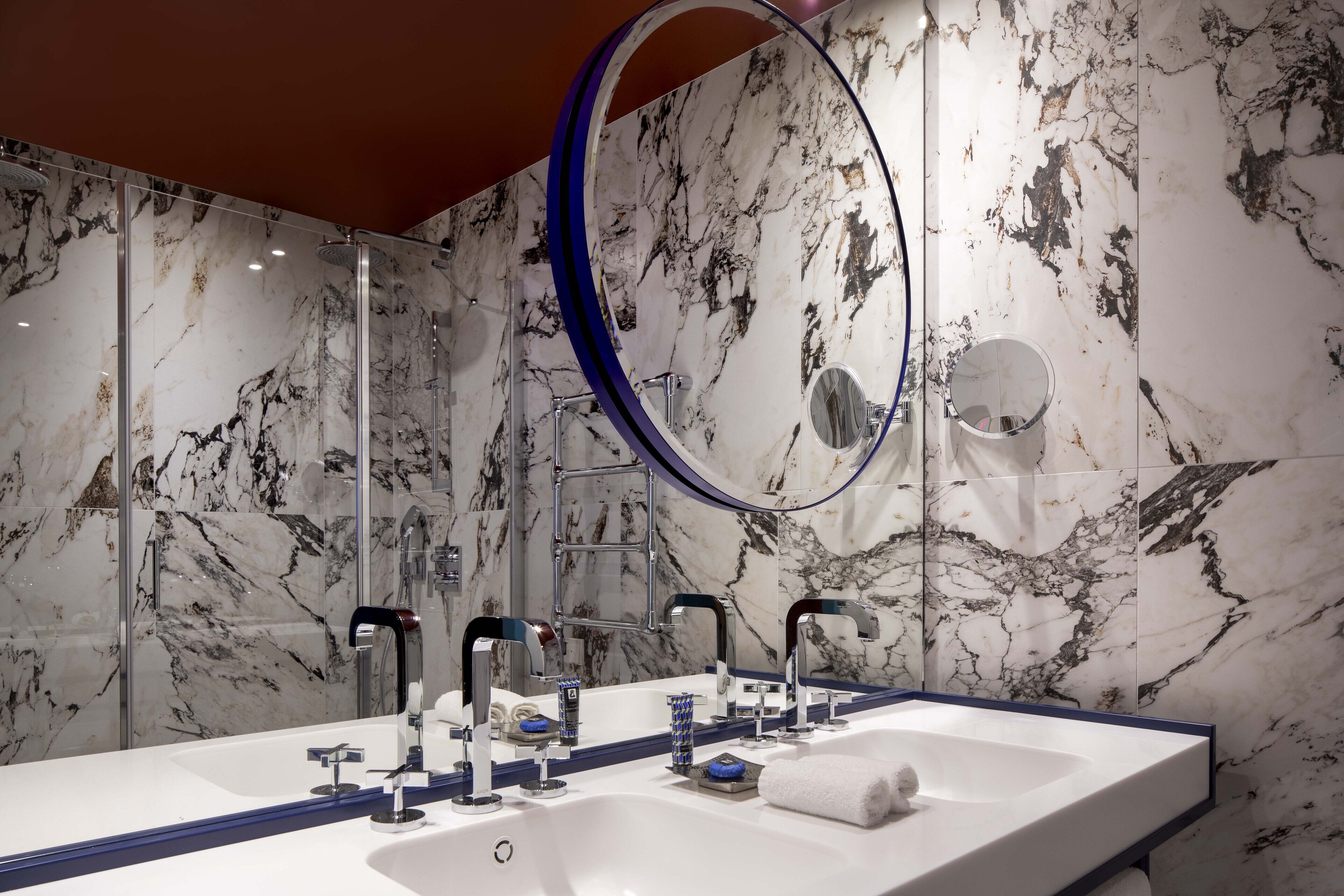 combined shower/bathtub, designer toiletries, hair dryer, bathrobes