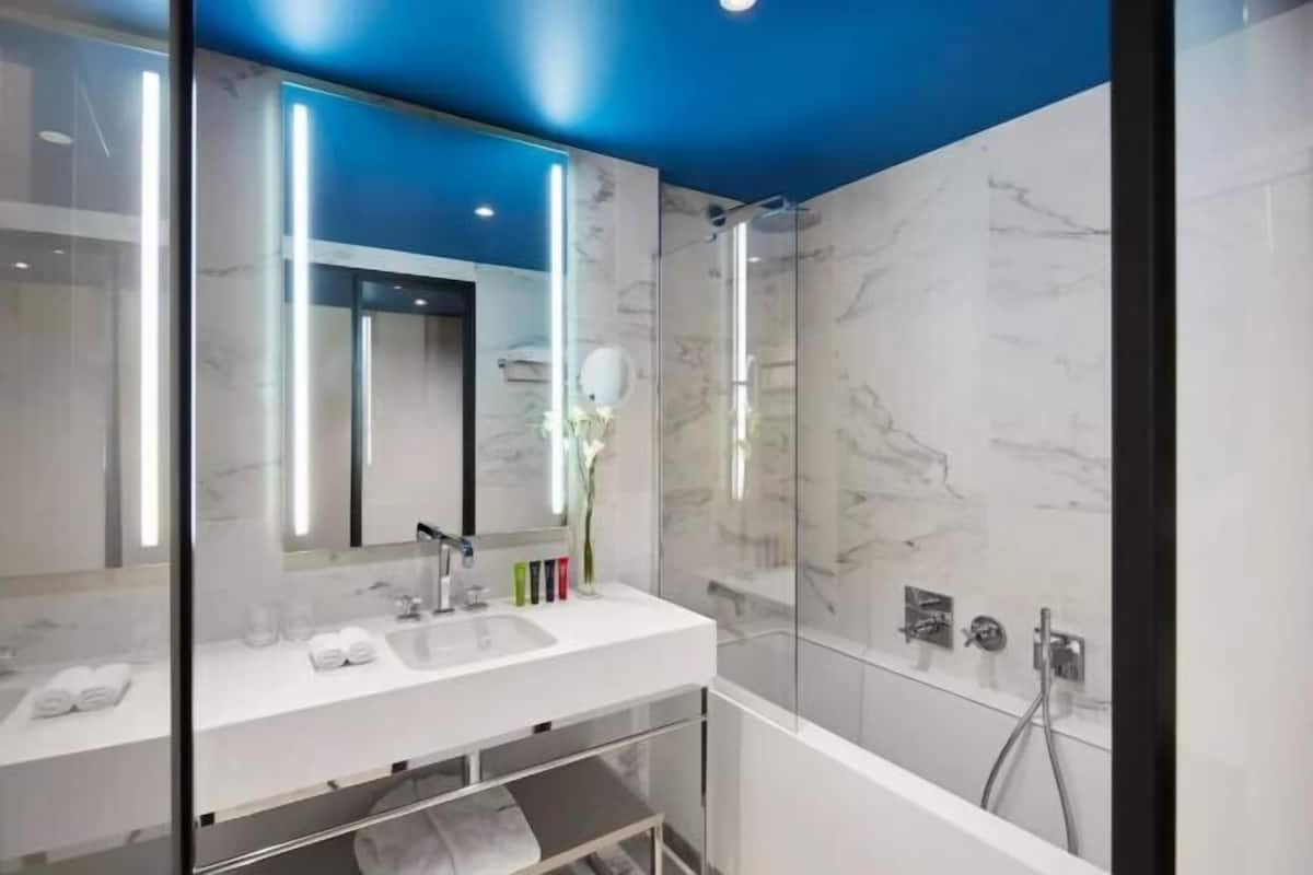 Bathroom | Combined shower/bathtub, designer toiletries, hair dryer, bathrobes