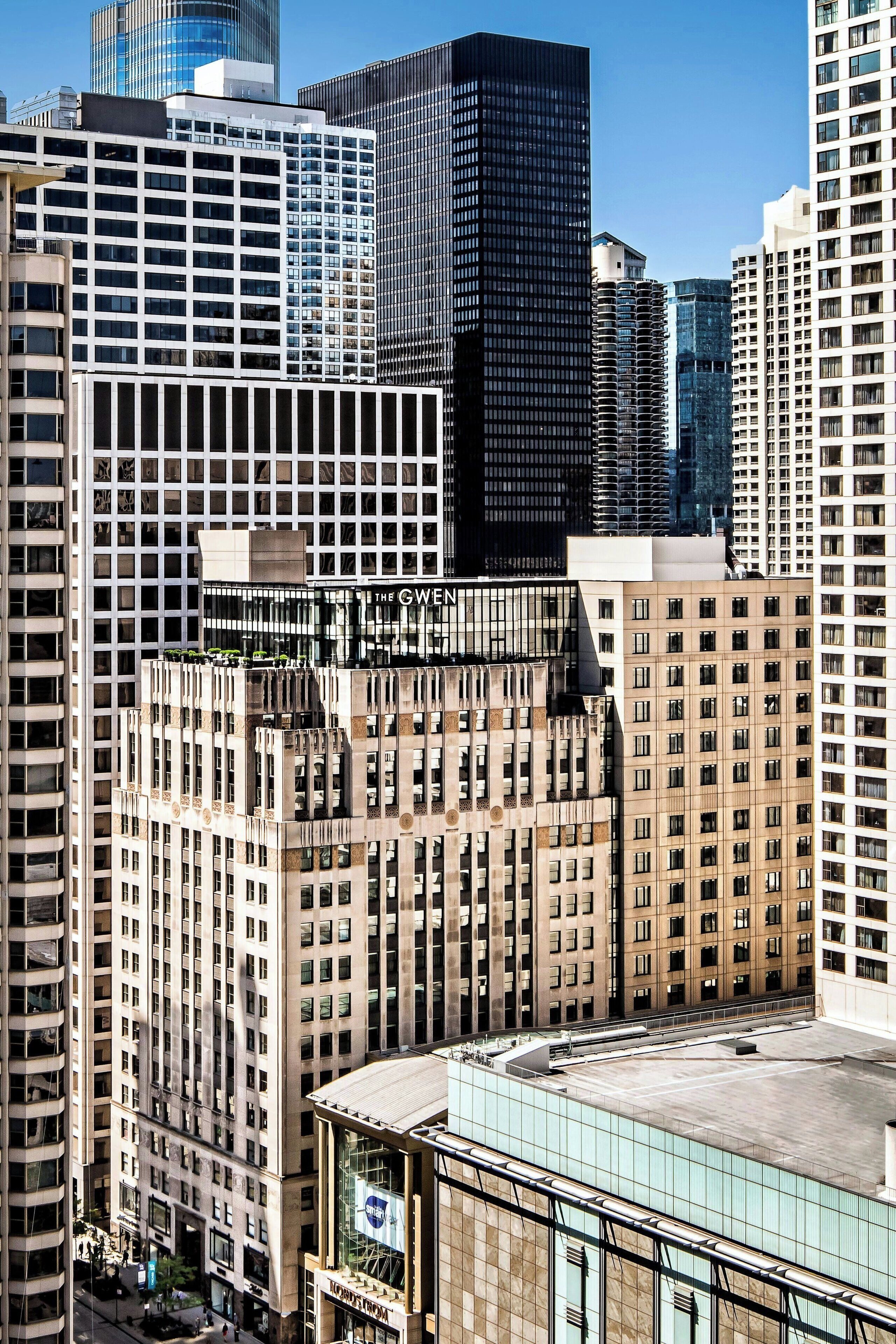 A high-rise building with a modern glass facade and a mix of architectural styles.
