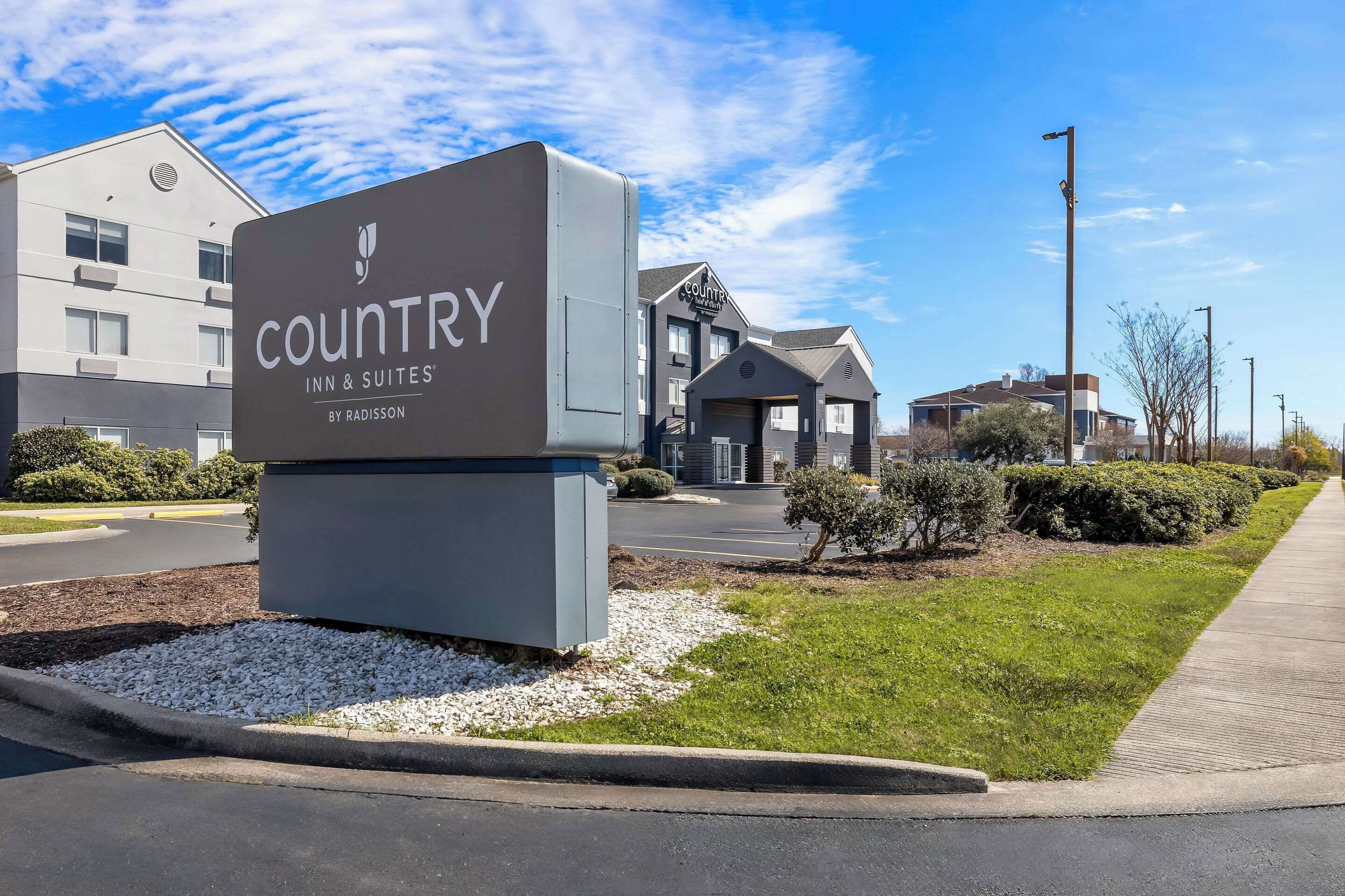 A sign for Country Inn & Suites by Radisson, indicating the name and branding of the hotel.