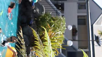 Outdoor pool, a heated pool, open 8:00 AM to 8:00 PM, pool loungers