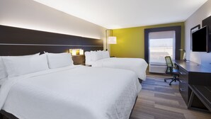 A hotel room with two beds, a desk, a chair, a TV, and a window with a view. - Holiday Inn Express Tiffin by IHG (Tiffin)