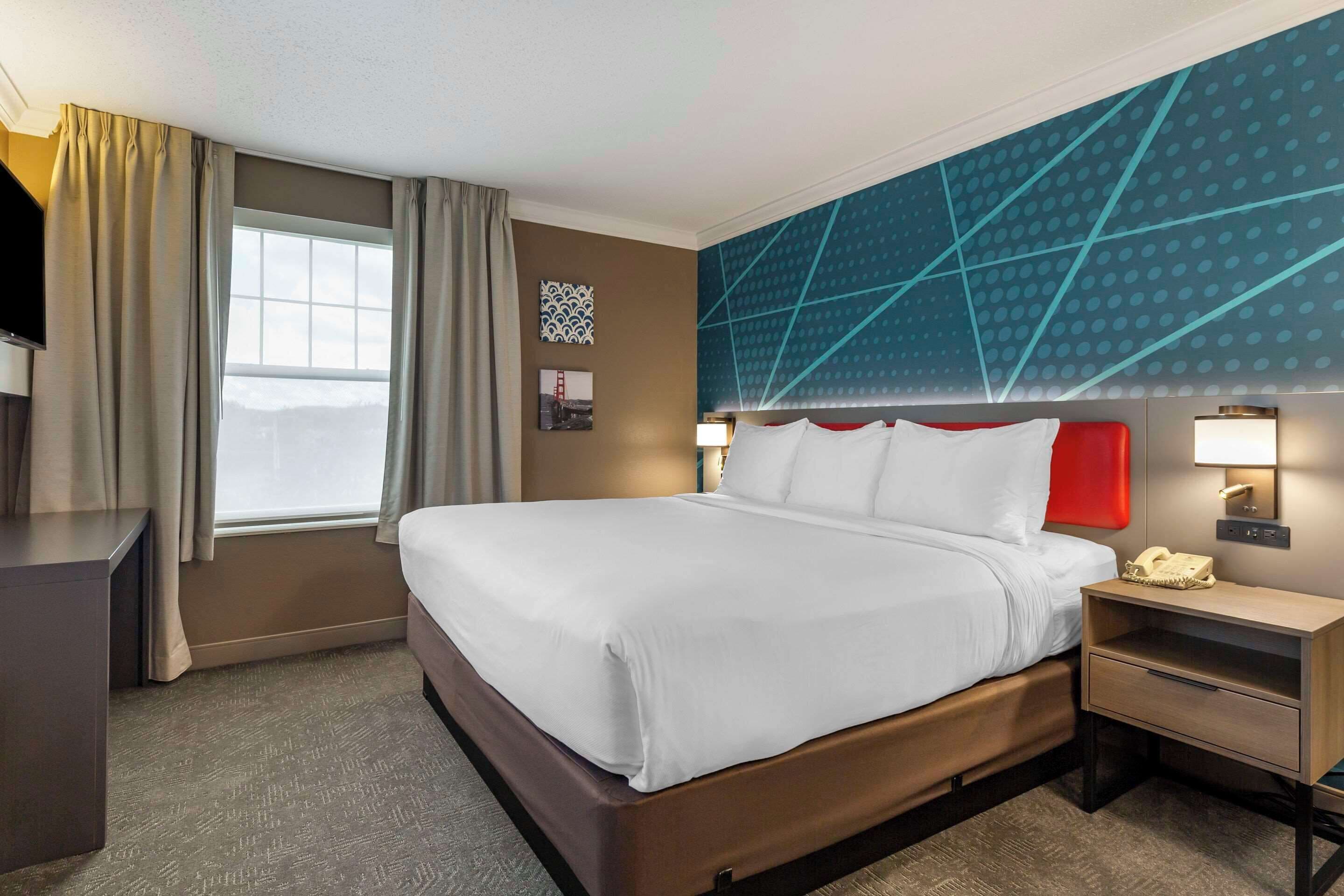 in-room safe, desk, blackout curtains, iron/ironing board