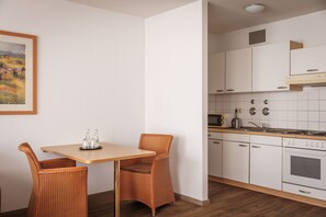 Full-sized fridge, stovetop