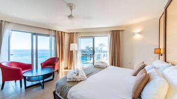 Junior Suite, Sea View | Minibar, in-room safe, desk, laptop workspace