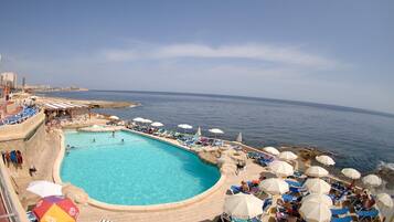 Indoor pool, outdoor pool, pool umbrellas, pool loungers