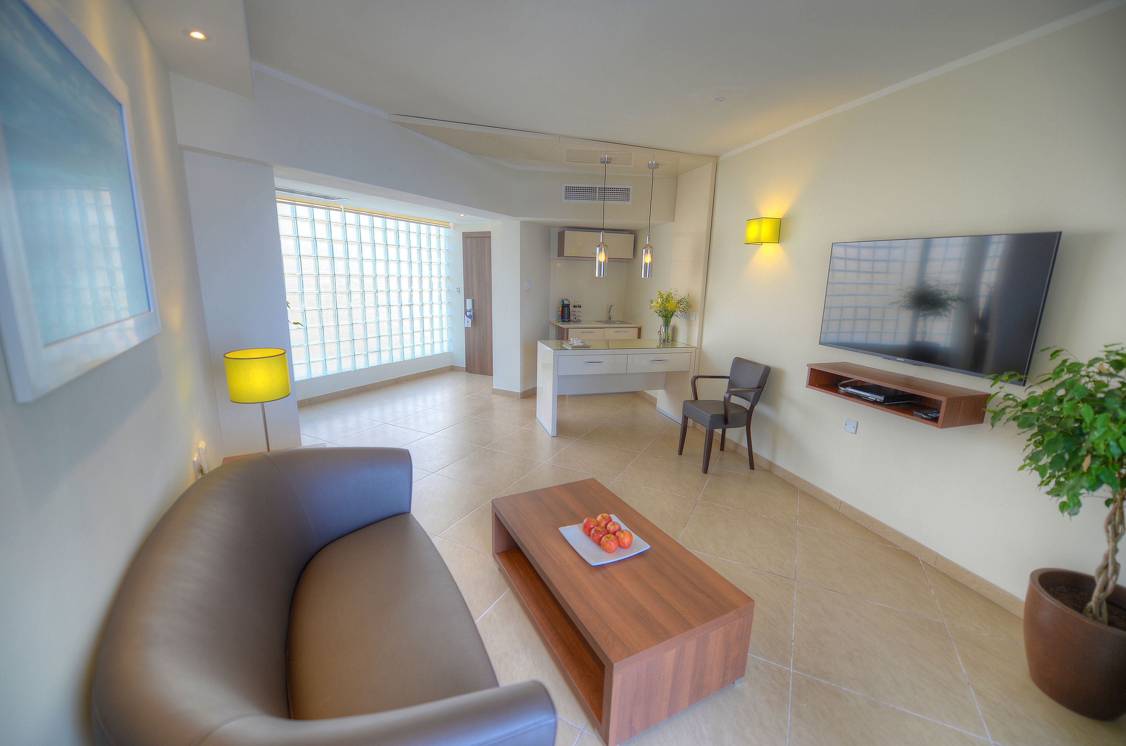 executive suite, sea view | living area | flat-screen tv