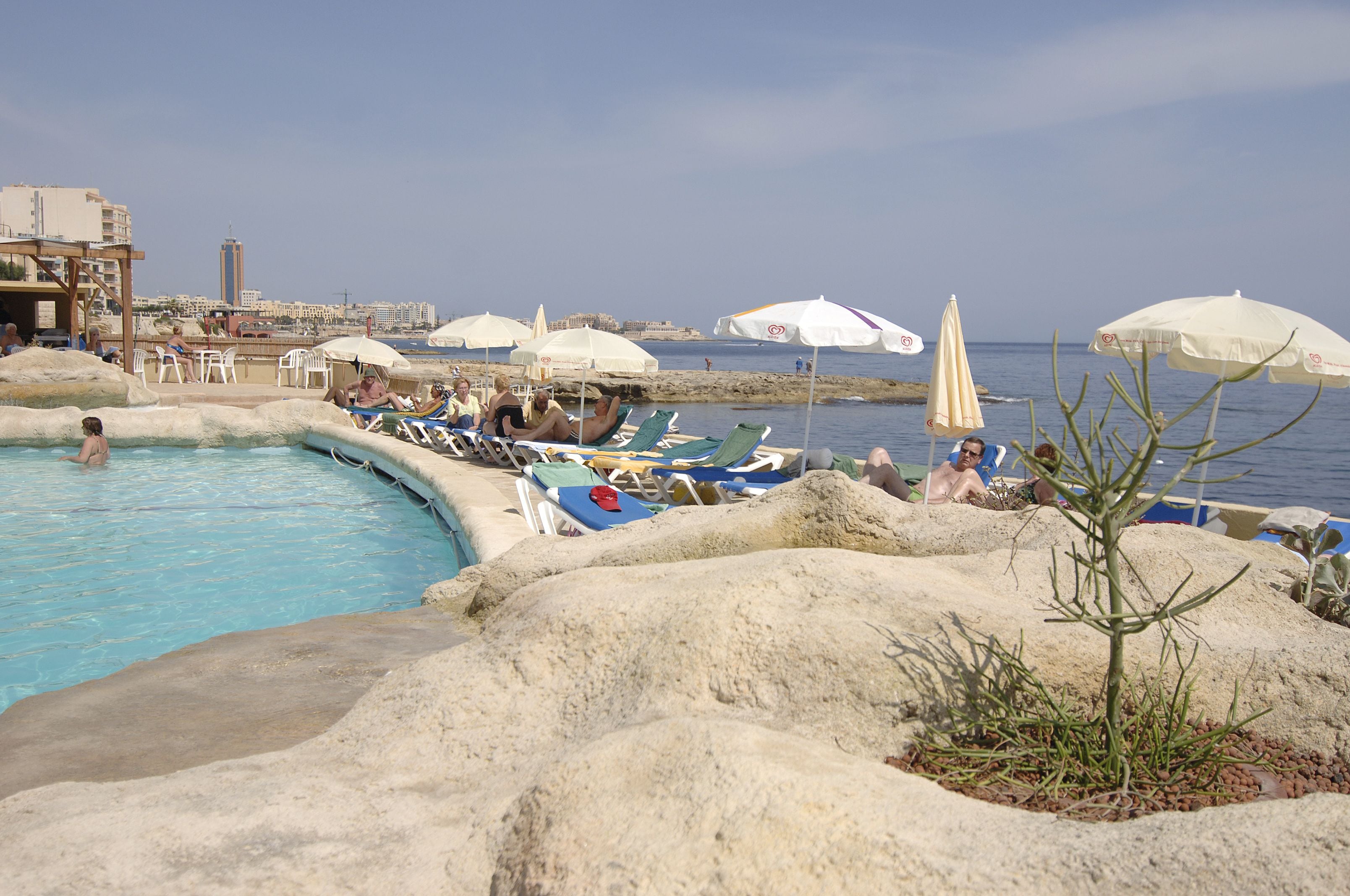 indoor pool, outdoor pool, pool umbrellas, pool loungers