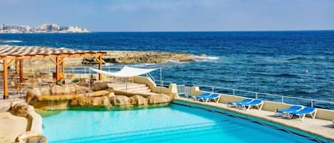 Indoor pool, outdoor pool, pool umbrellas, pool loungers